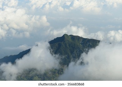 Top view mountain with mist and cloud.