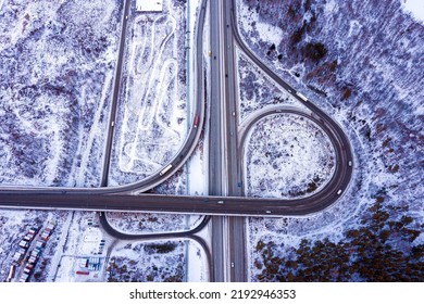 Top View Of The Movement Of Cars Through A Busy Intersection With An Overpass