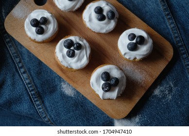 Top View Of Muffins With Blueberries On A Jeans Background