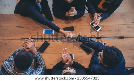 Top view of MultiEthnics Teamwork high five hands stack shakehand together. Collaboration Team Meeting in Conference Room. Diversity Partner Business Meeting brainstorm hand holding teamwork consult