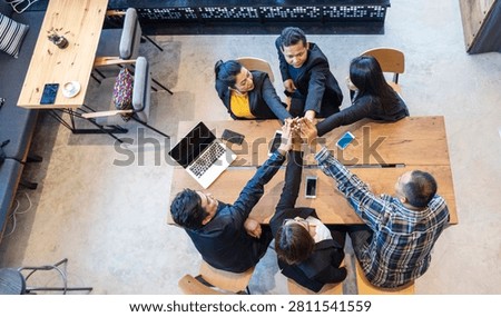 Top view of MultiEthnics Teamwork high five hands stack shakehand together. Collaboration Team Meeting in Conference Room. Diversity Partner Business Meeting brainstorm hand holding teamwork consult