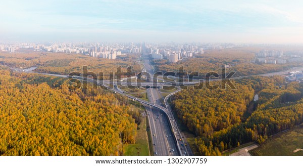 Top view of the multi-level road junction in Moscow\
from above, car traffic and many cars, the concept of\
transportation. road junction at the intersection of the Kievskoe\
highway and the ring road