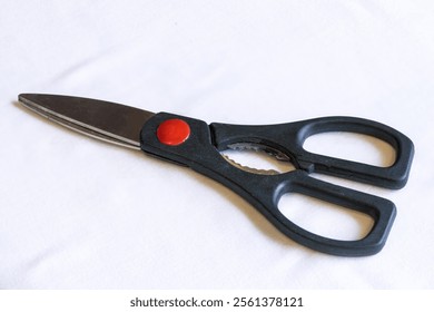 Top view of multipurpose kitchen scissors isolated on white.