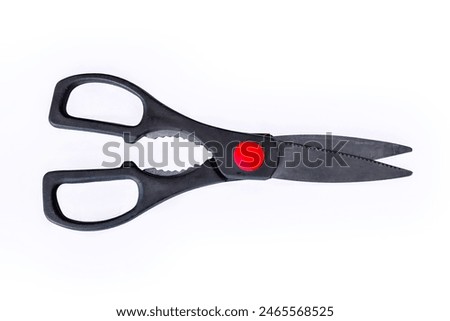 Top view of multipurpose kitchen scissors isolated on white.