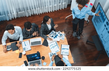 Top view multiracial analyst team use BI dashboard display on laptop screen, analyzing financial data for strategic decision. Fintech analyzes marketing indicators. Concord