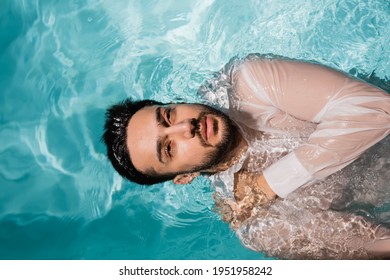 Top View Of Muslim Businessman In Shirt Swimming In Pool