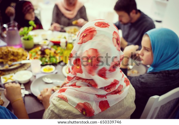 Top view of Muslim family gathering for eating\
iftar food in Ramadan