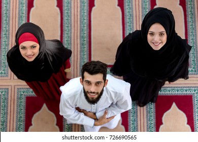 Top View Of Muslim Man And Woman Praying In Mosque