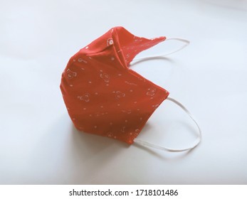 Top View Of My DIY Cotton Cloth Face Mask For Wearing To Protect Myself From Flu Virus And PM2.5 When In The Public Place On A White Paper Background, Shot With Light And Shadow.