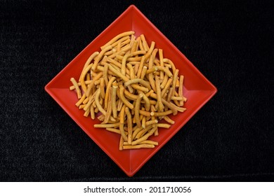 Top view of Namkeen salty spicy thick sev. or kara sev. tea time snacks eaten munching served during festivals also