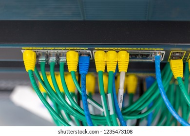 Top view of network cables connected in network switches hub. - Shutterstock ID 1235473108