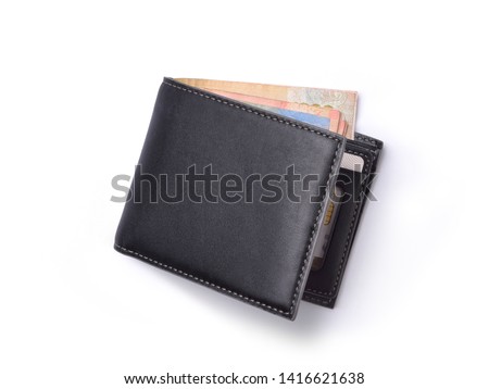 Top view of New black genuine leather wallet with banknotes and credit card inside isolated on white background. Сток-фото © 