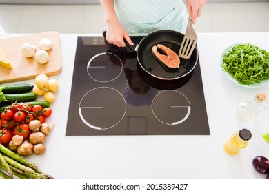 Top View Of Nice Skilled Girl Cooking Fresh Homemade Meal Cuisine Enjoying Ocean Food At Home Light White Kitchen Indoors