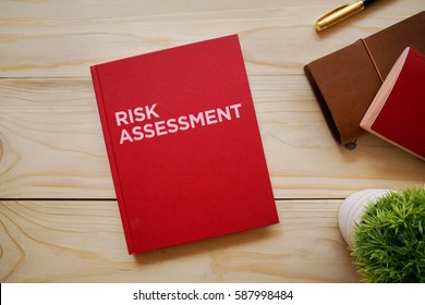 Top View Of Notebook With Word Risk Assessment