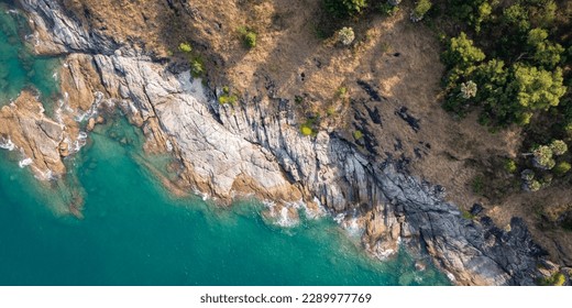 top view of ocean and rock texture. Aerial view of sea and fantastic Rocky coast. - Powered by Shutterstock