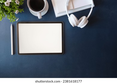 Top view office desk with digital tablet, coffee cup and notebook. - Powered by Shutterstock