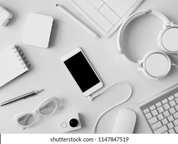 top view of office desk workspace with notebook, graphic tablet, smartphone and gadget on white background, graphic designer, Creative Designer concept.