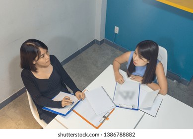Top view of office women discuss about work