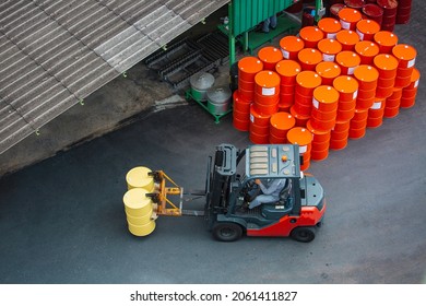 Top view oil barrels forklift truck move for on the transportation truck. - Powered by Shutterstock