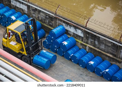 Top View Oil Barrels Forklift Truck Move For On The Transportation Truck.