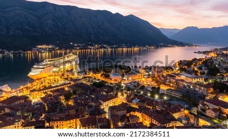 Top view of the old city of Kotor and the Kotor Bay with cruise ship at night. Montenegro