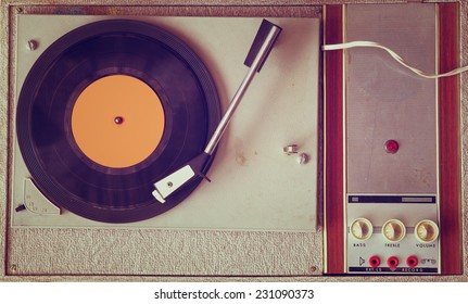 top view of old record player, image is retro filtered