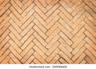 Top View Of Old Red Bricks Paving Stones Footpath On A Sidewalk Outdoors As Brickwork Weave Texture Or Abstract Stone Paver Herringbone Template Background