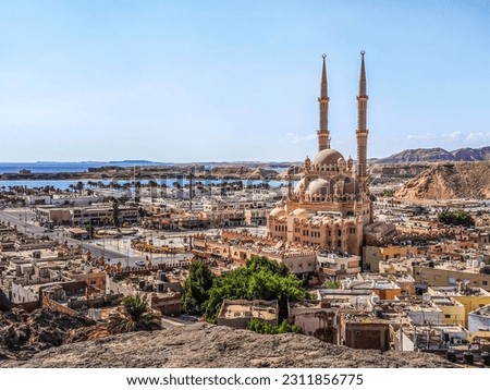 Top view of the old town of Sharm El Sheikh, Egypt. Beautiful cityscape with exotic egyptian architectures and Al Sahaba Mosque against the backdrop of the Red Sea