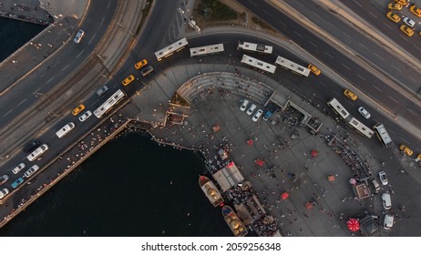 Top view on asphalted road in Istanbul with busses near water