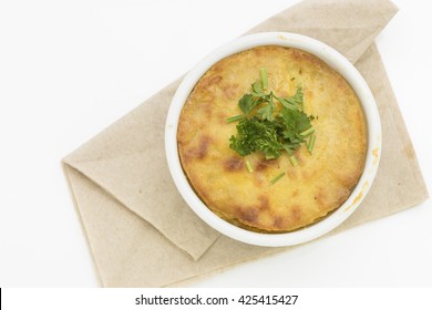 Top View On Baked Pot Pie With Crispy Mashed Potato Top And Parsley Garnish.  Isolated On White Background.