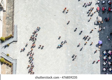 Top View On Cathedral Square With People Line To The Bell Tower Of Duomo In Florence