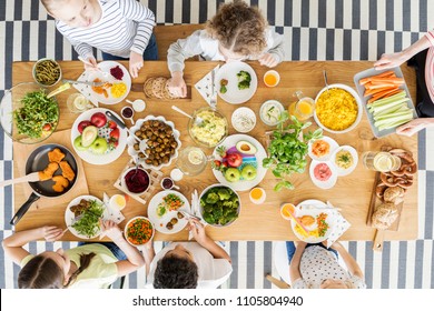 Top View On Children Eating Healthy Food During Friend's Birthday Party