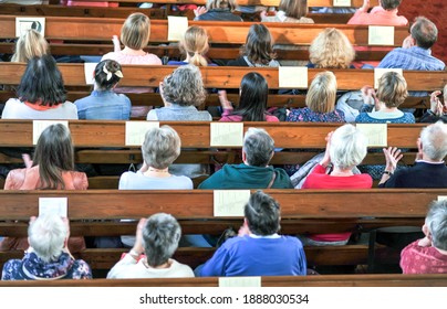 Top view on a Christian community at a church service or concert in a church - selective focus, blurred motion (hands)  - Shutterstock ID 1888030534