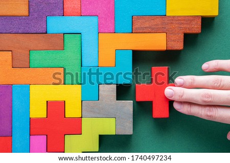 Top view on colorful wooden blocks. Concept of decision making process, logical thinking. Logical tasks