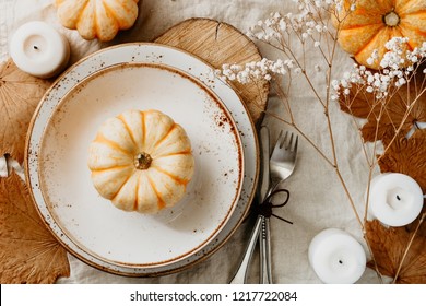 Top View On A Decorated Table Setting For Thanksgiving Dinner. Autumn Ornate, White Pumpkin On Ceramic Plates.