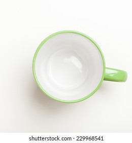 Top View On Empty Green Coffee Or Tea Mug Or Cup. Studio Shot From Above On White Background.