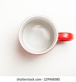 Top View On Empty Red Coffee Or Tea Mug Or Cup. Studio Shot From Above On White Background.