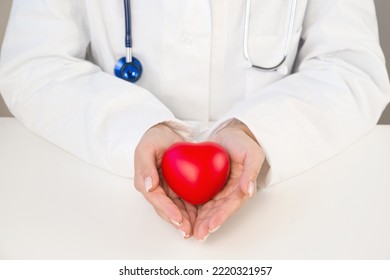 Top View On Heart In Doctor's Or Nurse's Hands. Organ Donation Or Charity Concept