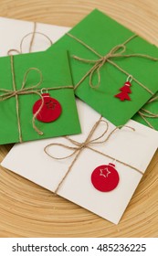 Top View On Pile Of Christmas Presents; Season Greetings, Cards In Envelopes With Nice Decorations And Ribbons. Christmas Concept