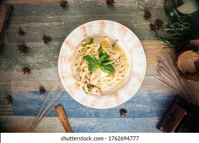 Top View On Tagliatelle Pasta With Mushrooms In A Creamy Sauce With Parmesan And White Wine, Horizontal