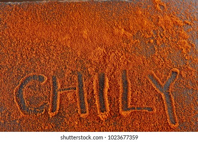 Top view on the texture background of red chilli pepper powder