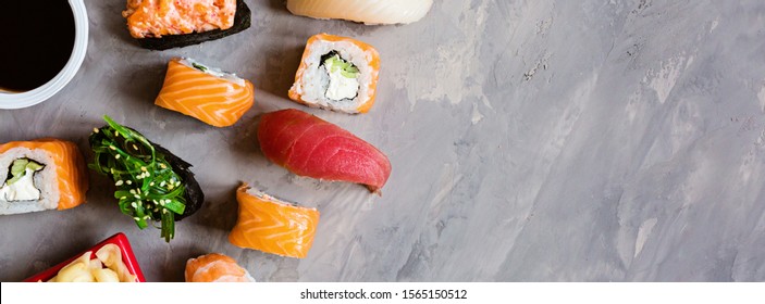 Top View On Traditional Japanese Empty With Sushi, Ginger, Soy Sauce, Wasabi On Concrete Gray Background, Mock Up. Online Food Delivery Concept