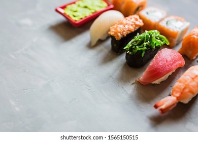 Top View On Traditional Japanese Empty With Sushi, Ginger, Soy Sauce, Wasabi On Concrete Gray Background, Mock Up. Online Food Delivery Concept