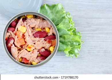 Top View Open Canned Tuna Fish Shredded With Vegetable Salad, Corn, Kidney Bean And Carrot On Wood. 