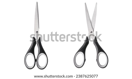 Top view of open and closed scissors on white background. Real photography of office scissors, stainless steel blades and black white handle.