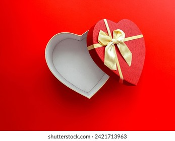 Top view of an open empty heart shaped box on a red background for your products. Happy Valentine's Day, Happy Women's Day, Happy Mother's Day, Happy Birthday. - Powered by Shutterstock