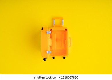 pastel yellow suitcase