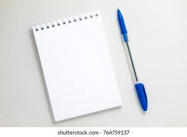 Top View Of Open Spiral Blank Notebook On White Background
