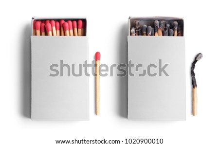 Top view of opened match boxes with burned matchsticks. Isolated on white background