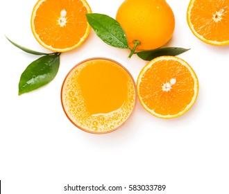 Top View Of Orange Juice In Glass And Orange Fruits With Green Leaves Isolated On White Background.